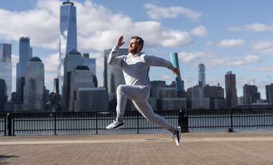 Sport running morning exercise. Man runner training in Manhattan. Sport athlete man running in New York city. Sport routine. Athlete man running outdoor. Core strength