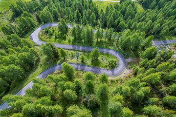 Snake Road in the Dolomites. Sunrise aerial forest