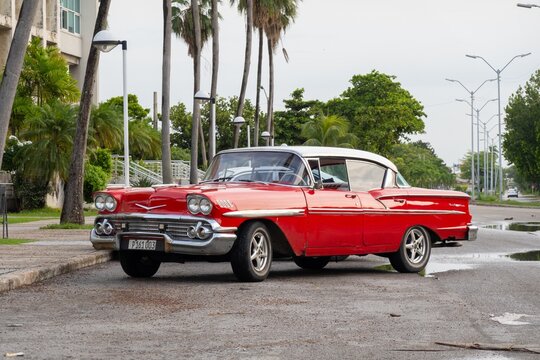 Red Chevrolet Bel Air 1958 vintage car in streets of Havana, Cuba