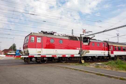 Locomotive 162 of Slovakian ZSR public transportation train company, motion blur on railway crossing