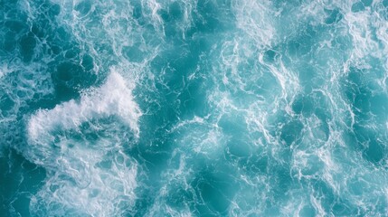 Obraz premium Background of the ocean view from the mountains. The drone captures spluttering footage of the ocean. Crystal's turquoise water as seen from above.