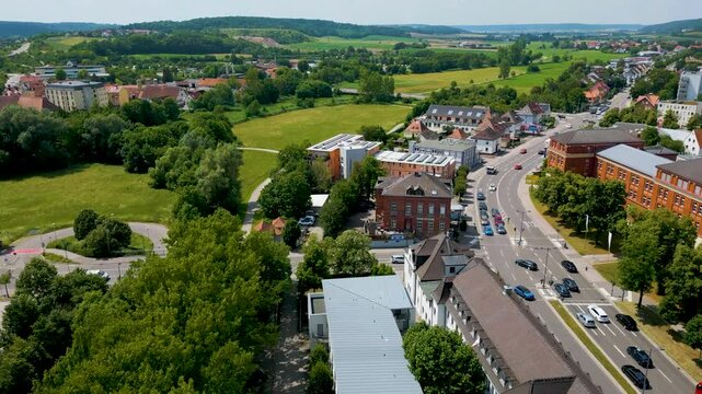 4K Aerial Drone Video of Businesses along the Frankische Rezat River in Ansbach, Germany