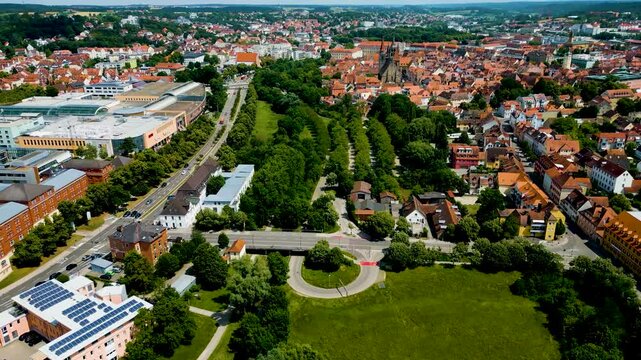 4K Aerial Drone Video of Rezatparkplatz West Parking Lot along the Frankische Rezat River in Ansbach, Germany