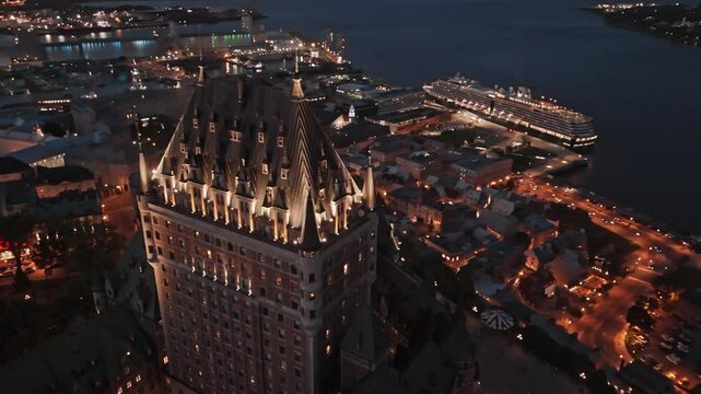 Aerial, Drone shot of hotel Fairmont le Chateau Frontenac. In Quebec city, during the sunset.