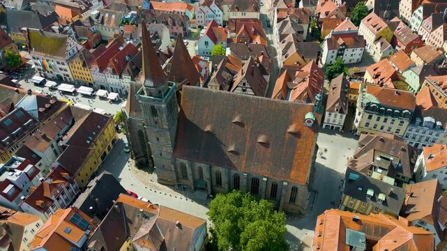 4K Aerial Drone Video of Farmers Market in the Courtyard of the St. Johannis Kirche Church in Downtown Ansbach, Germany