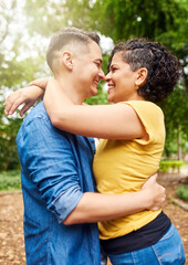 Obraz premium Outdoor, couple and laughing with hug for connection, happy marriage and relationship in backyard. People, woman and man with love embrace for bonding together, commitment and admiration in park