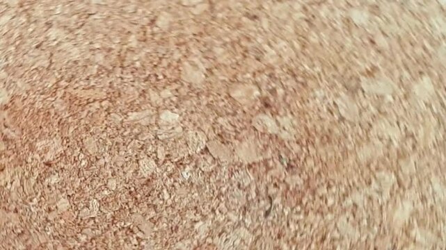 Footage of the wooden surface spinning. Background
