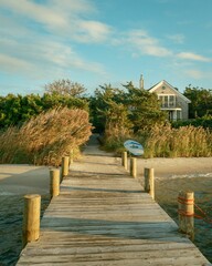 A dock in Dunewood, Fire Island, New York © jonbilous