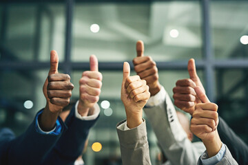 Business people, thumbs up and hands together for approval, celebration and collaboration success in office. Group, employee and workers with diversity, motivation or meeting for achievement support