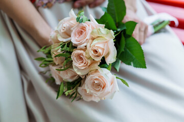 Elegant Wedding Bouquet of Soft Pink Roses Surrounded by Lush Greenery