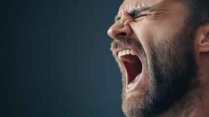 Obraz premium Intense Man with Beard Yelling in Dramatic Close-Up