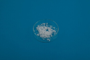 Calcium nitrate in Petri dish. Inorganic salt of nitric acid. Other names: Kalksalpeter, Norgessalpeter, nitrocalcite, Norwegian salpeter. Calcium nitrate is applied as a fertilizer for all crops