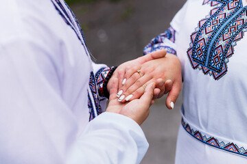 Tender Moments: Ukrainian Hands Intertwined in Traditional Embroidery