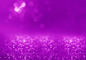 Shiny violet glitter, closeup. Halloween background, bokeh effect
