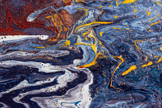 Abstract oil painting texture with vibrant blue, yellow, and red swirls