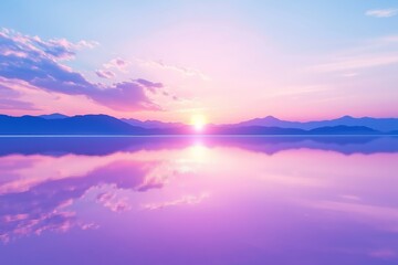 Obraz premium A serene view of mirror-like salt flats reflecting a colorful sunset with soft pink and purple hues, scattered clouds, and distant mountains