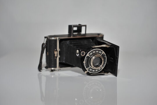 Old vintage foto camera isolated on white background - Powered by Adobe