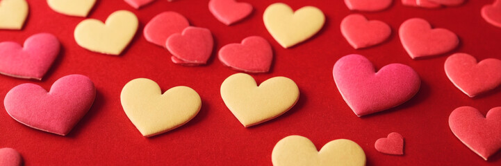Obraz premium Decorative red hearts create a romantic atmosphere for special occasions or celebrations.