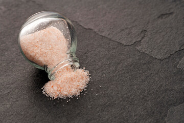Pink Himalayan salt - Fine crystals in a glass salt shaker.