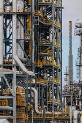 Pipes and chimney at the decommisioned  Marsden Point Refinery, Whangarei, Northland, New Zealand.