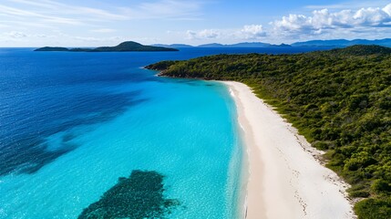 Aerial view of a pristine beach with turquoise waters and white sand, ideal for travel promotions