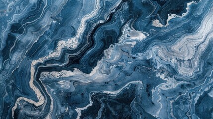 Obraz premium An abstract pattern of blue marble with swirls of white and grey, creating a calming and serene background