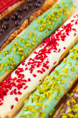  Crispy wafer tube adorned with edible embellishments.Wafer pastries.Assorted wafer rolls close-up.Wafer rolls with dried raspberries, pistachio crumbs and chocolate.Summer Berry Baking.sweet dessert.