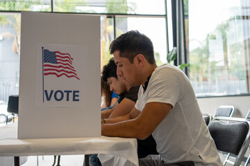 hispanic man at the voting booth station, diverse group of people in the us election, concept of...
