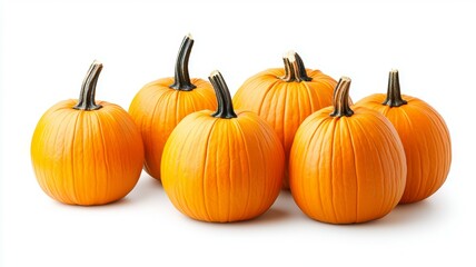 Obraz premium A row of six orange pumpkins are lined up on a white background