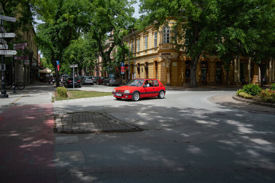 Red Peugeot 205 1.9 GTI is driving in Subotica, Srebia 09.06.2024