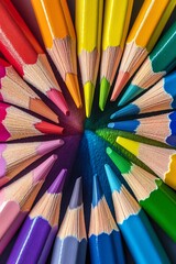 Colorful pencils arranged in a circle on a black background.