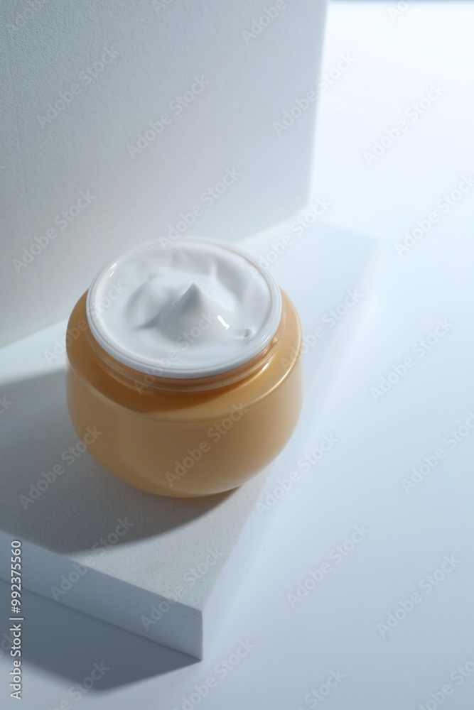 Poster Face cream in jar on white background. Cosmetic product