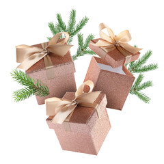 Gift boxes and fir tree branches in air on white background. Christmas celebration