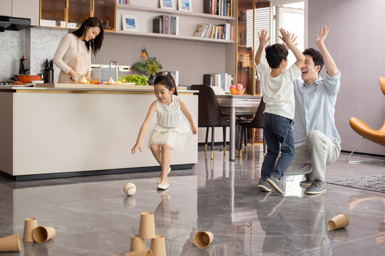 Family Playing Little Game At Home