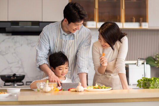 Family Cooking In The Kitchen