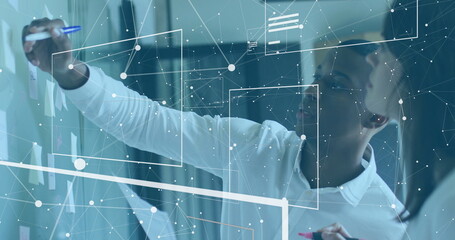 Image of interface processing data over african american businessman working at office