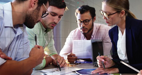 Image of financial data processing over diverse business people in office