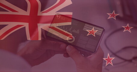 Holding smartphone with data charts, person with New Zealand flag image overlay