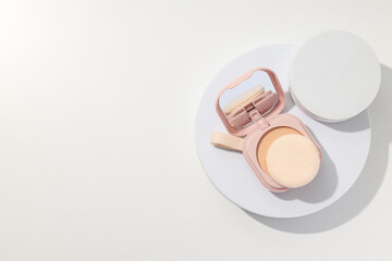 Face powder, light shade on a light background.