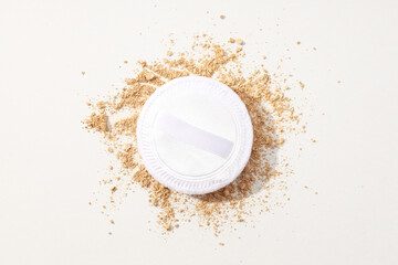 Face powder, light shade on a light background.