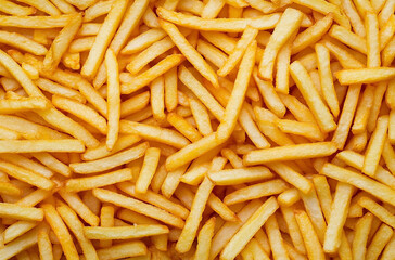 Fototapeta premium close-up of french fries with many golden and crisp cut strips