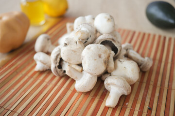Fresh, organic White Mushrooms beautifully arranged on a rustic Wooden Cutting Board