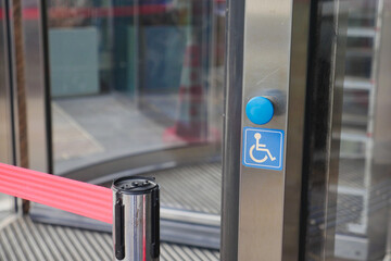 This accessible revolving door has a push button for easy entrance for everyone, including disabled