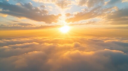 Aerial View of Golden Sunset Above Soft Clouds