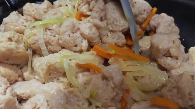 Cooking soy meat close-up. Vegetarian food.