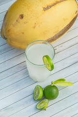 Fresh coconut water from yellow coconuts added with lime juice