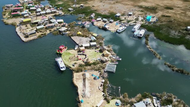 Flyover floating community, tourist destination Uros Islands in Peru