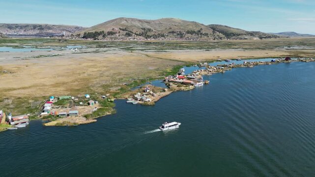 Lake Titicaca tour boat visits Uros floating islands of Peru, aerial