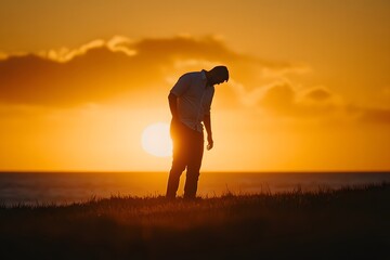 Silhouette of Man Standing in Sunset on Beach