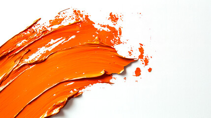 A bright juicy smear of orange paint on a white background. Textured splashes of orange acrylic paint on a white canvas. An element for the design. Stylish backdrop. The scene is dynamic